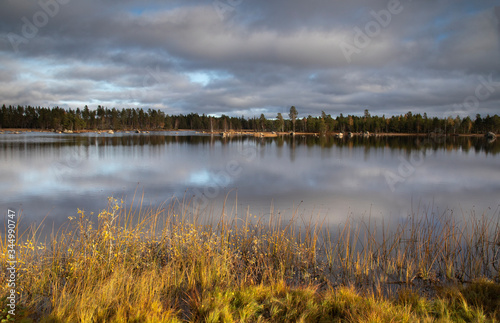 Fototapeta Naklejka Na Ścianę i Meble -  
Cloudy sky over autumn lake