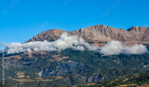 Beautiful landscape with clous and peaks in  The Southern French Alps in Alpes-de-Haute-Provence region.