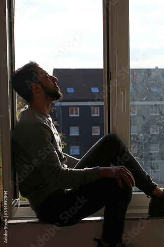 Dorsten, germany, 1 may man looking from window background high quality prints