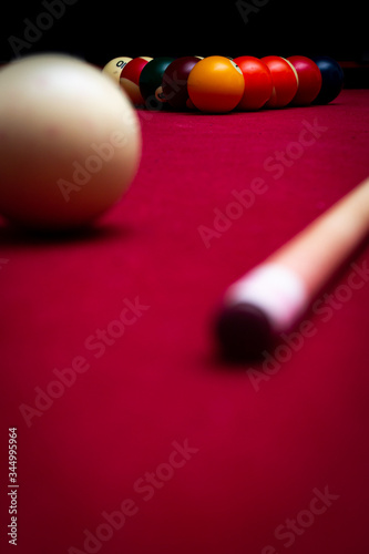 Billiard balls on a red felt pool table