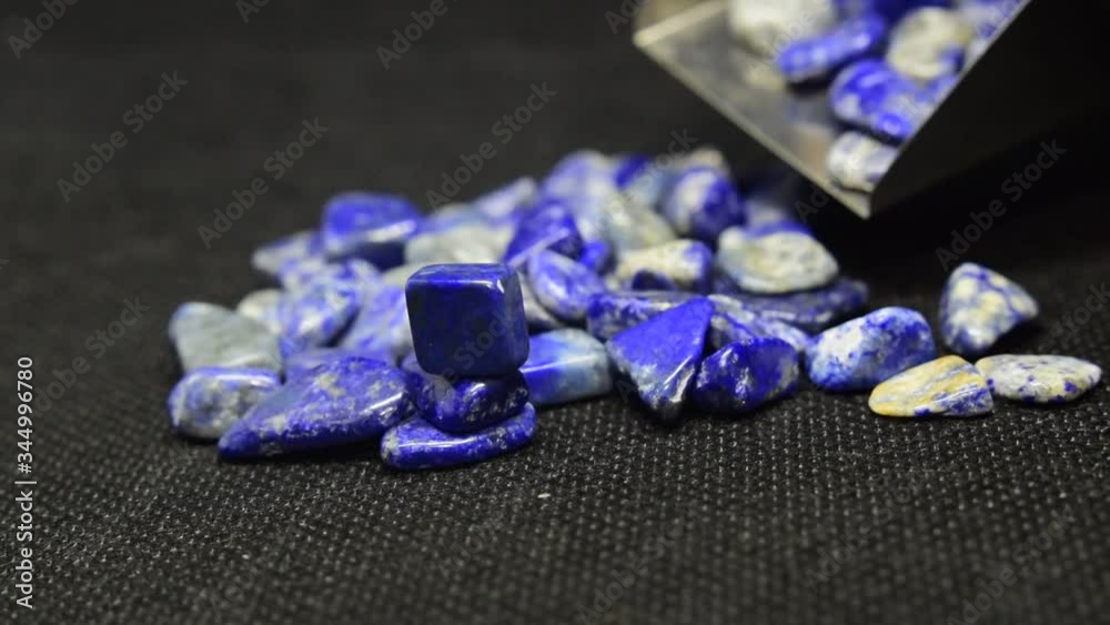 Lapis Is a beautiful natural gemstone on a wooden floor	