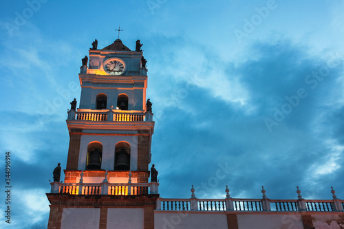 Illuminated tower at sunset of Sucre Cathedral, Bolivia photo