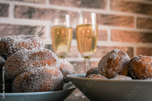 Two types of sugar donuts and sima. Traditional labour day sweets.
