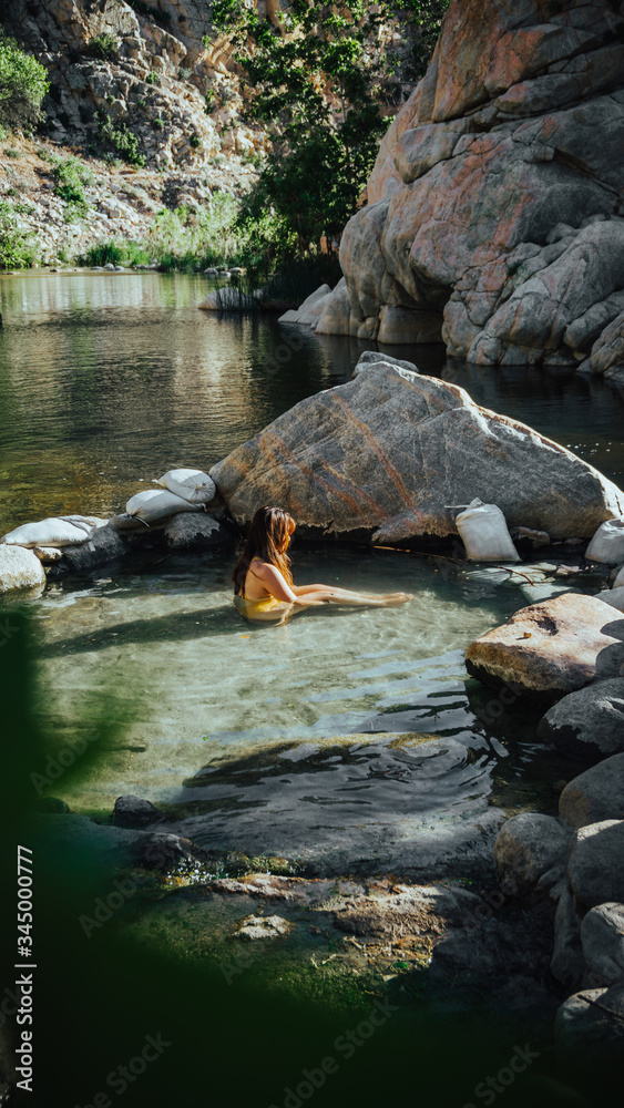 Fototapeta premium Young girl dreaming in a hot tub