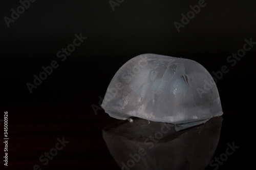 ice cube details, Concept photo with dramatic light and black background