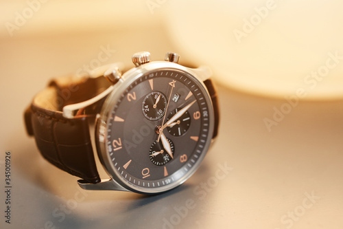 Elegant luxury men's watch. Dark leather straps