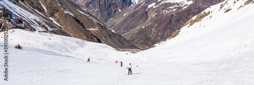 ski in chile on a sunny day with lots of snow.