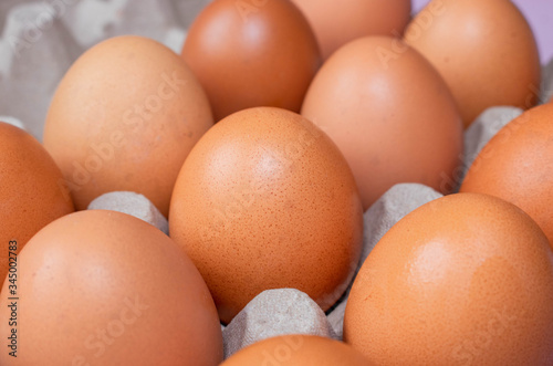 Egg carton on white background. White background with eggs. Food photography. Eggs photography. Brown eggs.
