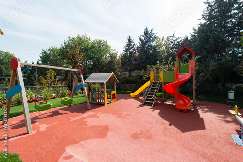 Wallpaper Mural Children's toys on the playground. Swing carousel in the park for children. Torontodigital.ca