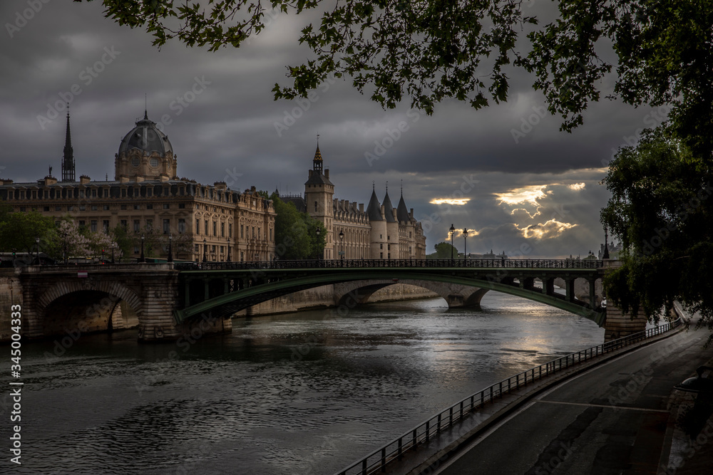 Paris, France - April 28, 2020: Panoramic view of the Conciergerie, the Hotel Dieu and the bridges over the Seine during the containment measures due to the coronavirus