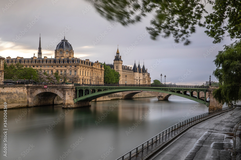 Paris, France - April 28, 2020: Panoramic view of the Conciergerie, the Hotel Dieu and the bridges over the Seine during the containment measures due to the coronavirus