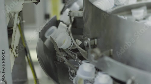 plastic bottles on Medical Solutions Conveyor . Blow fill seal technology technique used to produce liquid-filled container on medical or food industrial factory. medical industry photo