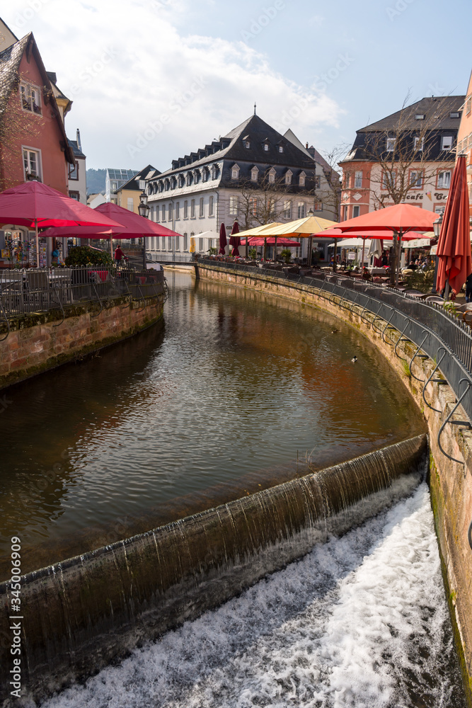 Saarburg, Germany - April 13 2019: View of the Leukbach river in the old town of Saarburg