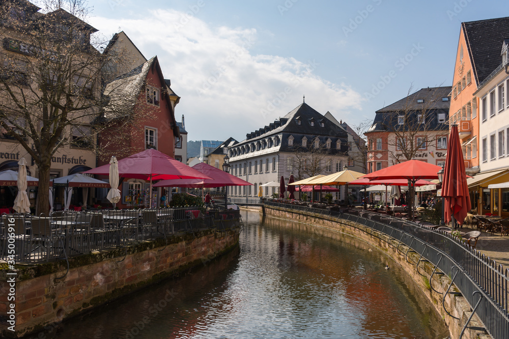 Saarburg, Germany - April 13 2019: View of the Leukbach river in the old town of Saarburg