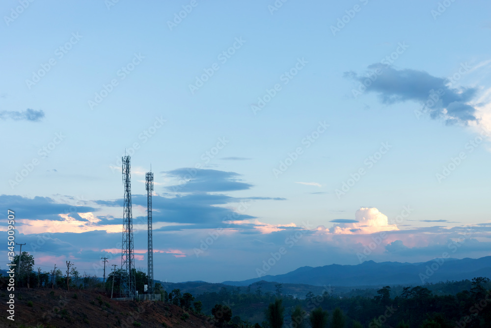 Telecommunication tower on top of the mountain with colorful sky