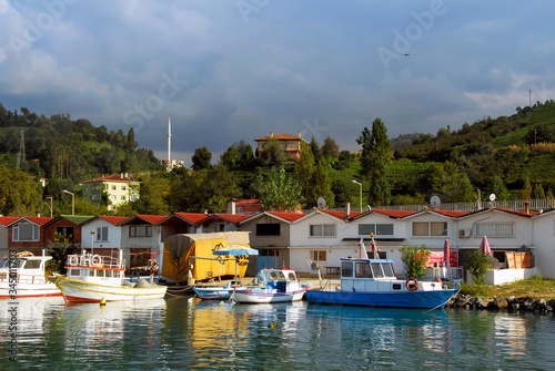 TRABZON, TURKEY - SEPTEMBER 24, 2009: Fishing Shelter, Boats, Mosque and Buildings. Of District