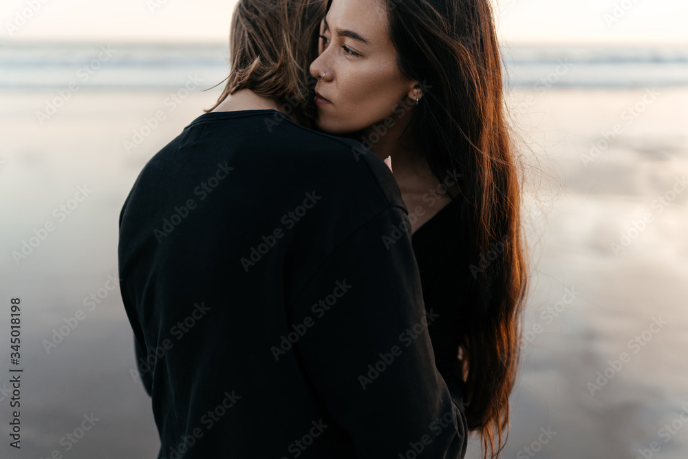 Attractive man and woman enjoying romantic evening on sunset Attractive man and woman enjoying romantic evening on sunset