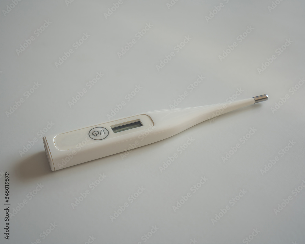 a white digital thermometer concept a white digital thermometer concept