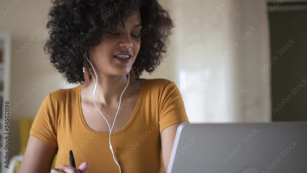 Girl woman teen with headphones learning online on laptop Spbd, asking teacher a question and listen to answer. communicate, writing, distance education concept. self isolation on quarantine