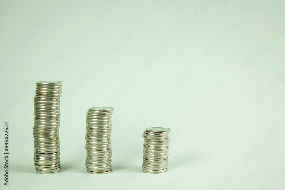 Stacks of coins on a gray background, Growth and preservation of money, concept of finance and economy