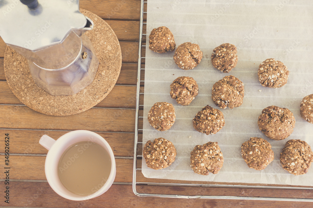 homemade oat cookies, coffee cup and moka pot homemade oat cookies, coffee cup and moka pot
