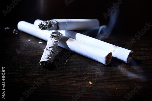 фотографія cigarettes on the table. Smoking cigarette bad habits concept.