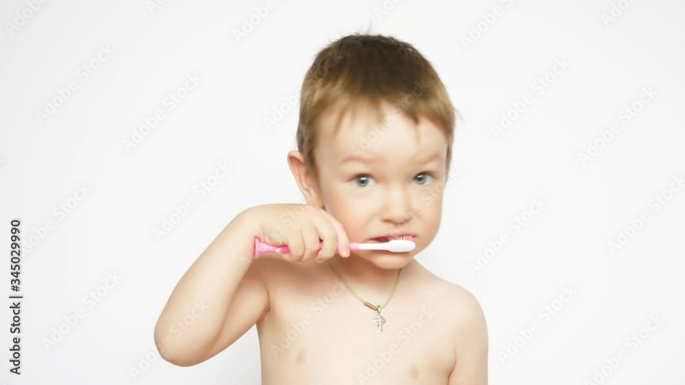 A beautiful nude little boy boy brushes his teeth A beautiful nude little boy boy brushes his teeth