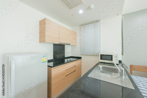 Modern kitchen interior with electric and microwave oven