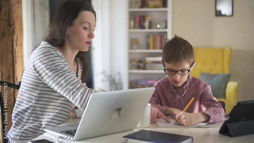 mom helps son do homework on distant learning during quarantine. Spbd modern parent with laptop explain lesson task for child. concept quarantine, stay home, isolated. mom helps son do homework on distant learning during quarantine. Spbd modern parent with laptop explain lesson task for child. concept quarantine, stay home, isolated.
