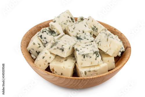 diced Blue cheese in wooden bowl isolated on white background with clipping path and full depth of field.