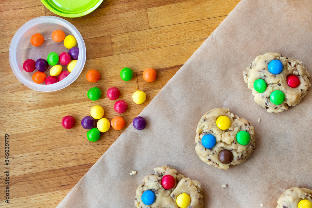 Cooking together at home. Stay and safe. Isolation. Make homemade cookies with colored pills