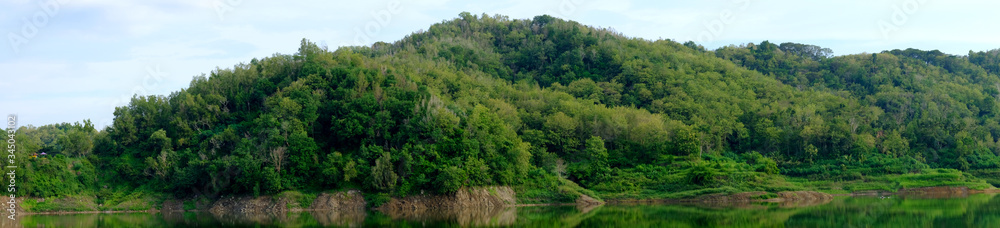 green hills with water reflection