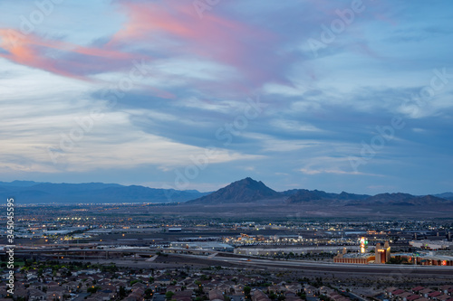 Sunset high angle view of the Frenchman Mountain and cityscape from Henderson View Pass