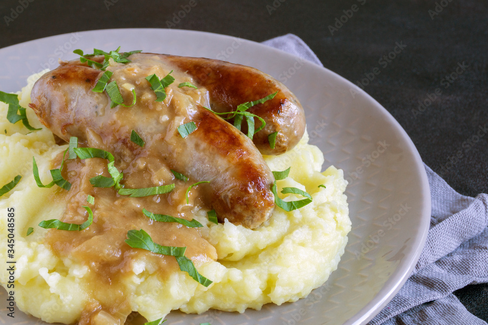 English sausages with mashed potatoes and gravy. English sausages with mashed potatoes and gravy.