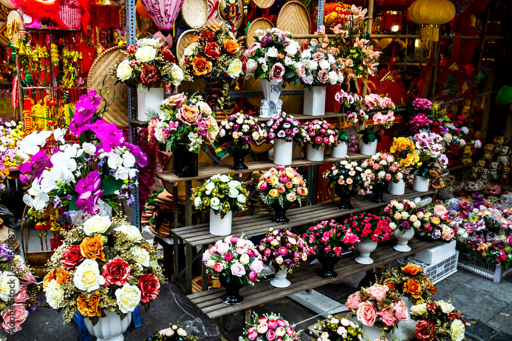 Beautiful bunches of flower for decorations and ceremonies in a shop in the old town of Hanoi, Vietnam.