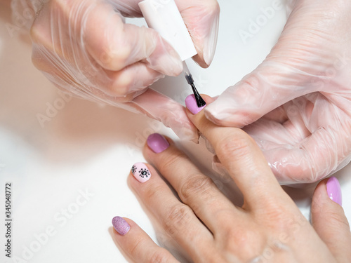 Manicure procedures. Nail uv-varnish  close-up