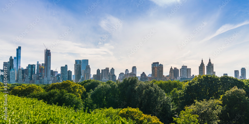 Obraz premium Central park,new york,usa. 09-01-17: central park with Manhattan skyline on the sunny day in summer season.