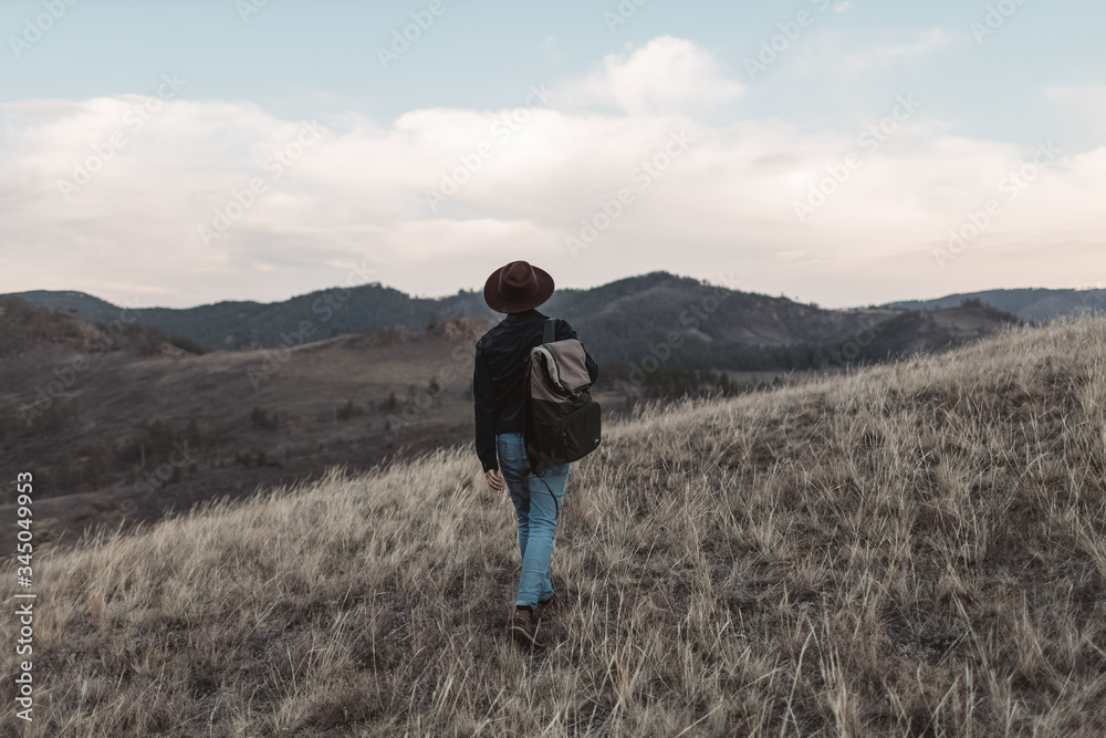 young man walking in the mountains