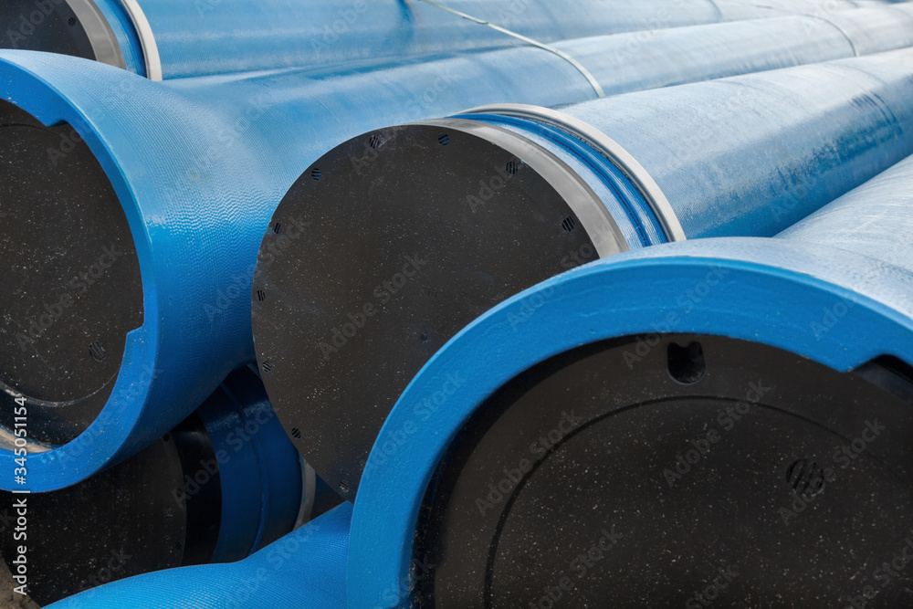 Stack of new blue pipes (tubes) Stack of new blue pipes (tubes)