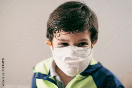 four years old boy with facial mask portrait