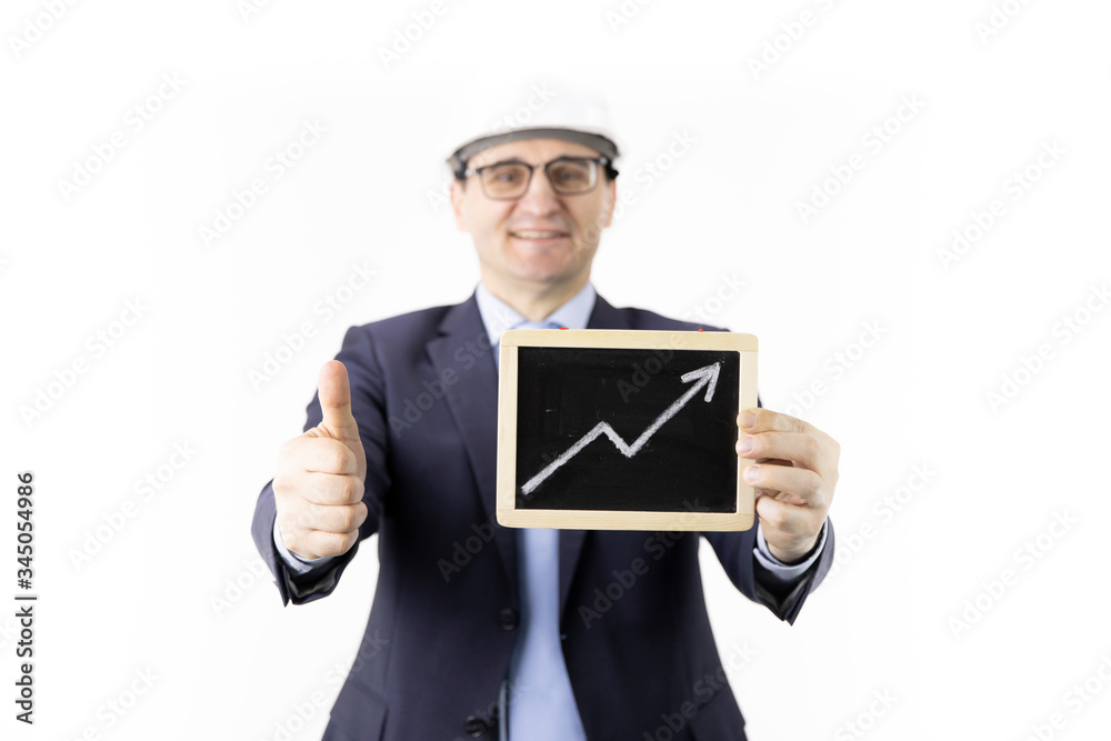 Happy businessman holds sign with up arrow rising oil quotes showing like sign. Oil refinery industry, market strengthening, growth of quotes, sales and supply growth, petroleum engineering concept Happy businessman holds sign with up arrow rising oil quotes showing like sign. Oil refinery industry, market strengthening, growth of quotes, sales and supply growth, petroleum engineering concept