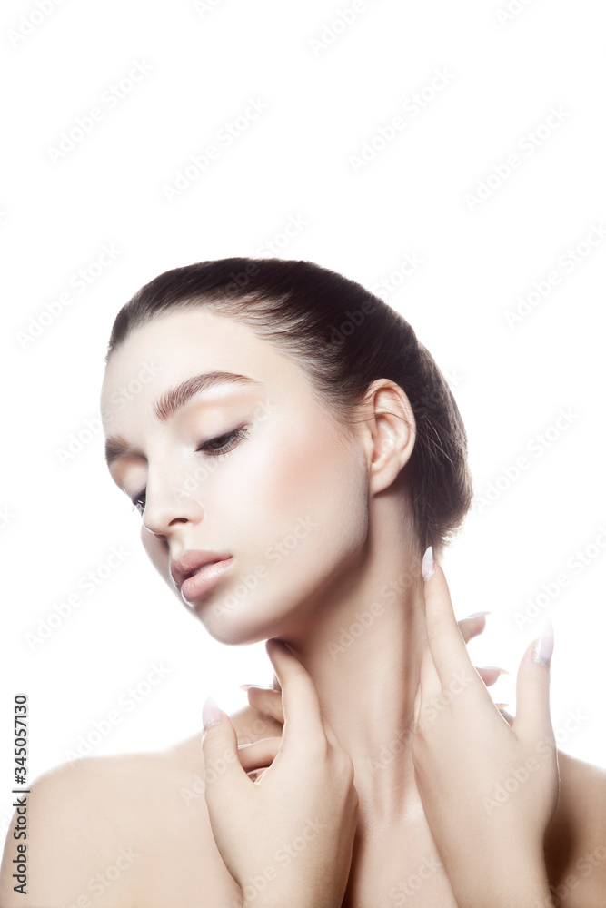 Beautiful Young Woman Beauty Portrait touching Face Perfect skin. Brunette hair, natural makeup. Isolated. White background. Copy space Beautiful Young Woman Beauty Portrait touching Face Perfect skin. Brunette hair, natural makeup. Isolated. White background. Copy space