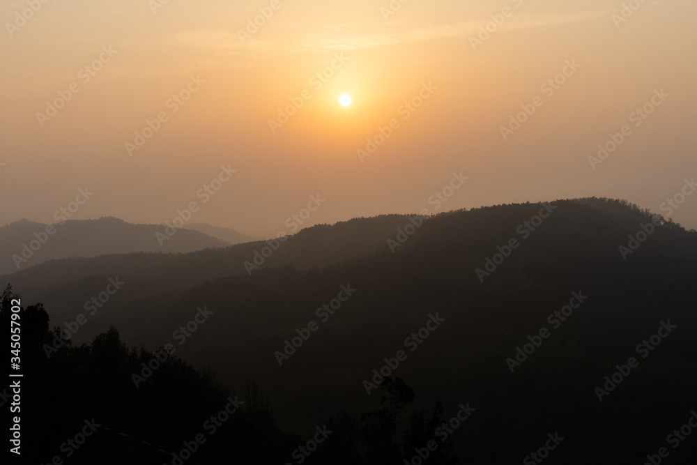 Golden sunrise on the mountain range of yercaud in Tamil Nadu India.