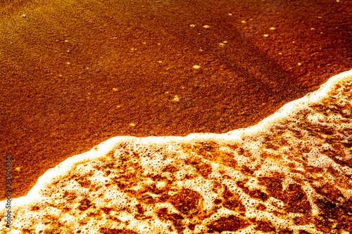 Summer. Sea. Sandy beach and fine sand. Small waves. Background.