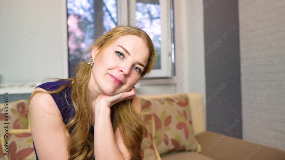Young beautiful woman is dreaming. Calm mood, serenity and self-confidence. slow motion video. Young beautiful woman is dreaming. Calm mood, serenity and self-confidence. slow motion video.