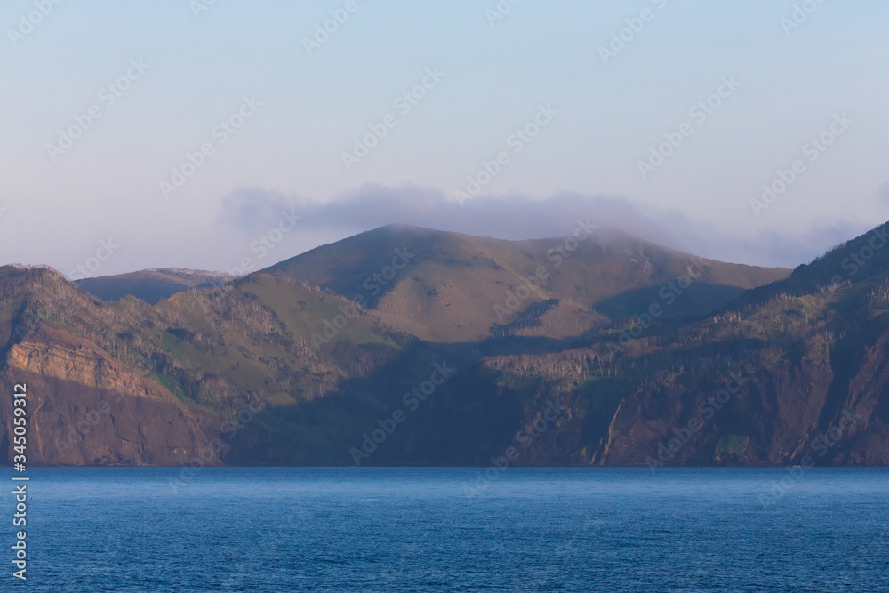 View on a Kunashir island with volcano Tyatya from the sea