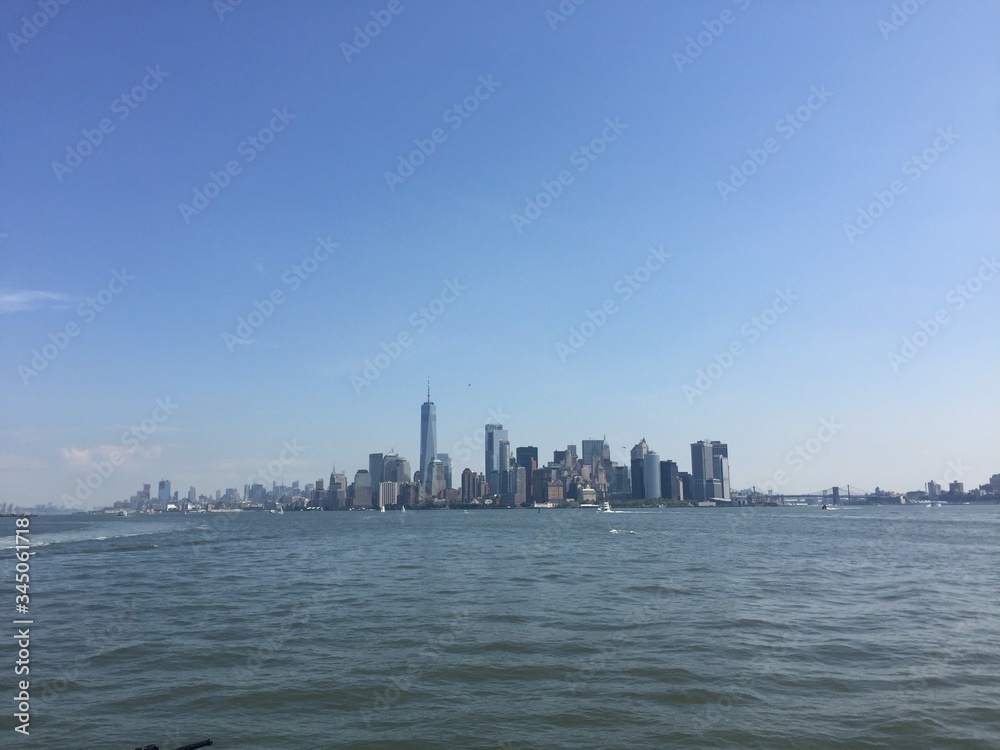New York City Manhattan skyline from the sea in a sunny day