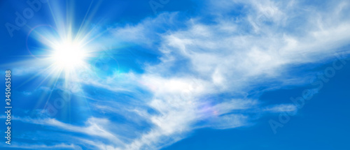 Sunny background  blue sky with white clouds and sun