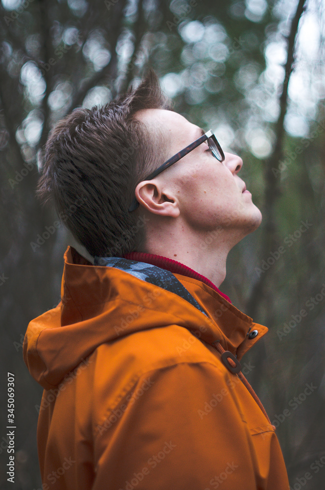 Fototapeta premium young man in the forest