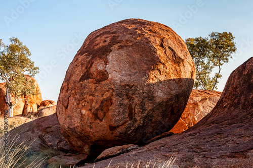 A round-shaped boulder in the Devils Marbles Conservation Reserve, Northern Territory, Australia photo